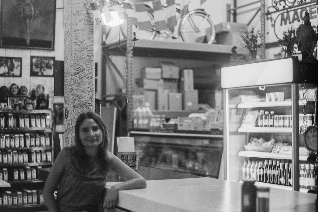 Black-and-white portrait inside Maceo Spice and Import Company